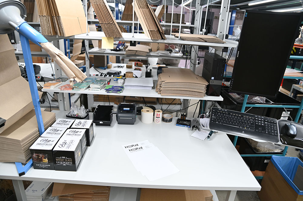 Packing station at Hop.nl where orders are carefully prepared